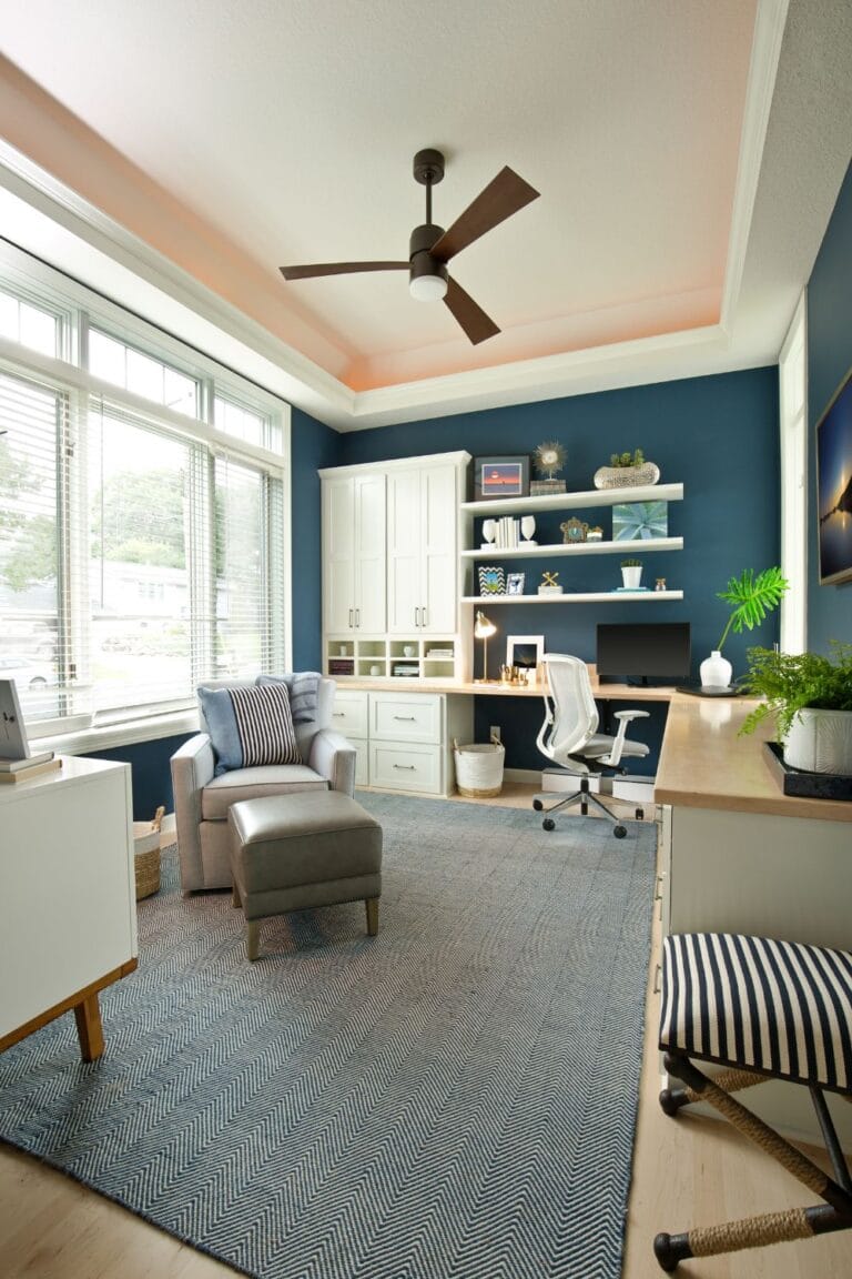 home office with blue accent wall and natural light modern workspace design