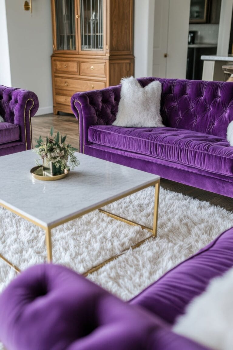 purple living room with tufted velvet sofas white rug and marble coffee table